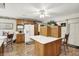 Spacious kitchen featuring a center island, wooden cabinets, and modern appliances at 10036 E Troy Ave, Indianapolis, IN 46239