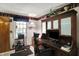 Home office with custom wood built-ins, a comfortable workspace, and natural light, ideal for productivity at 10036 E Troy Ave, Indianapolis, IN 46239