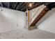 Spacious basement with stairs leading up to the main level, partially finished with carpet flooring at 1108 N Ritter Ave, Indianapolis, IN 46219