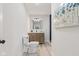 Well-lit bathroom includes modern vanity, stylish mirror, and contemporary fixtures at 1108 N Ritter Ave, Indianapolis, IN 46219