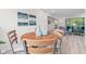 Bright dining area with a wood table, comfortable seating, and natural light at 1108 N Ritter Ave, Indianapolis, IN 46219
