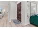 Charming entryway with hardwood floors, a patterned rug and view of the bedroom at 1108 N Ritter Ave, Indianapolis, IN 46219