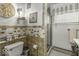 Bathroom featuring a tiled wall design and glass-enclosed shower at 1190 W Jefferson St, Franklin, IN 46131