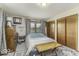 Bright bedroom with patterned rug, dresser, and bed with wood accent table at 1190 W Jefferson St, Franklin, IN 46131
