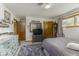 Comfortable bedroom featuring a metal bed frame, dresser, and ample closet space at 1190 W Jefferson St, Franklin, IN 46131