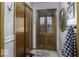 Cozy entryway featuring a wooden door with glass panels, a closet, and decorative accents at 1190 W Jefferson St, Franklin, IN 46131