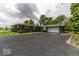 Ranch-style home with a paved driveway and attached two-car garage at 1190 W Jefferson St, Franklin, IN 46131