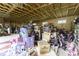 Messy garage filled with assorted items and exposed wooden beams at 1190 W Jefferson St, Franklin, IN 46131