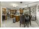 A cozy eat-in kitchen features wood cabinets, an island and stainless steel appliances at 1190 W Jefferson St, Franklin, IN 46131