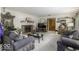 Cozy living room with a brick fireplace, plush sofas, and ample natural light at 1190 W Jefferson St, Franklin, IN 46131