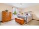 Cozy bedroom featuring a black metal bed frame, wooden chest, and a window for natural light at 12082 Old Stone Dr, Indianapolis, IN 46236