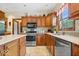 Close up on the kitchen area, showcasing stainless steel appliances and decorative accents at 12082 Old Stone Dr, Indianapolis, IN 46236