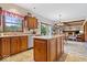 Spacious kitchen featuring a center island, seamless integration with breakfast nook, and adjacent living areas at 12082 Old Stone Dr, Indianapolis, IN 46236