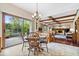 Open-concept design blends kitchen and dining, flowing to a comfortable living room with a fireplace at 12082 Old Stone Dr, Indianapolis, IN 46236