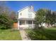 Charming two-story home with a front porch, a walkway, and a well-kept lawn at 1236 Central Ave, Indianapolis, IN 46202