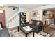 Comfortable living room with stairs and an open view to the kitchen at 1236 Central Ave, Indianapolis, IN 46202