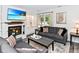 Inviting living room with a fireplace, neutral decor, comfortable seating, and ample natural light at 1236 Central Ave, Indianapolis, IN 46202