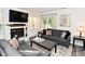 Bright living room featuring a fireplace, hardwood floors and sliding glass door at 1236 Central Ave, Indianapolis, IN 46202