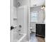 Bright bathroom featuring a shower-tub combination and modern vanity at 1237 W State Rd 38, Pendleton, IN 46064