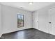 Cozy bedroom with hardwood floors, light walls, and a large window at 1237 W State Rd 38, Pendleton, IN 46064