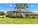 Quaint single-story home with a covered porch and manicured landscaping at 1237 W State Rd 38, Pendleton, IN 46064