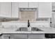 Updated kitchen sink with stainless steel fixtures and marble countertops at 1237 W State Rd 38, Pendleton, IN 46064