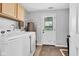Laundry room with washer, dryer, and ample storage space at 1237 W State Rd 38, Pendleton, IN 46064