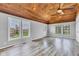 Open living room with wood-paneled ceiling and lots of natural light at 1237 W State Rd 38, Pendleton, IN 46064