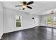 Sunlit living room with refinished hardwood floors and neutral wall colors at 1237 W State Rd 38, Pendleton, IN 46064