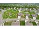 Expansive aerial view of new construction neighborhood, showcasing home's location near playground at 1270 Shaw Ln, Shelbyville, IN 46176