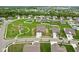 Expansive aerial view of new construction neighborhood, showcasing home's location near playground at 1270 Shaw Ln, Shelbyville, IN 46176