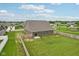 Aerial view displaying a large backyard with a wooden fence ensuring privacy in a Gathering-friendly neighborhood at 1270 Shaw Ln, Shelbyville, IN 46176