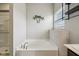 Clean bathroom with a modern soaking tub, decorative palm tree accent, and tiled shower at 1270 Shaw Ln, Shelbyville, IN 46176