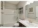 Clean bathroom with a tub-shower combo, white subway tile, and a modern vanity at 1270 Shaw Ln, Shelbyville, IN 46176