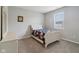 Well-lit bedroom featuring neutral paint, carpet, window overlooking the neighborhood, and white furniture at 1270 Shaw Ln, Shelbyville, IN 46176