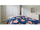 Bedroom featuring gray walls, carpet, closet door, and dresser with mirror at 1270 Shaw Ln, Shelbyville, IN 46176