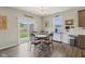 Bright dining area with sliding glass doors to the backyard and stylish decor at 1270 Shaw Ln, Shelbyville, IN 46176