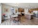 Charming dining area adjacent to the kitchen with hardwood floors and natural light at 1270 Shaw Ln, Shelbyville, IN 46176