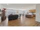 Spacious open-concept living room with wood floors seamlessly connects to the kitchen at 1270 Shaw Ln, Shelbyville, IN 46176