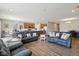 Open-concept living area showcases wood floors, connecting living, dining, and kitchen spaces at 1270 Shaw Ln, Shelbyville, IN 46176