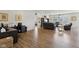 Versatile living space with wood floors adjacent to an office and a connected kitchen and dining area at 1270 Shaw Ln, Shelbyville, IN 46176