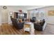 Inviting living room boasts wood floors, plenty of natural light, and comfortable seating at 1270 Shaw Ln, Shelbyville, IN 46176