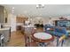 Open concept living space featuring a kitchen island and comfortable seating area at 1270 Shaw Ln, Shelbyville, IN 46176