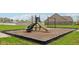 Exterior community playground with modern play equipment for , perfect for outdoor fun at 1270 Shaw Ln, Shelbyville, IN 46176