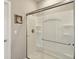 Bathroom showing a clear glass shower with built in shelves, and brushed metal fixtures at 1270 Shaw Ln, Shelbyville, IN 46176