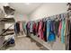 Spacious walk-in closet with ample shelving and hanging storage for clothes and shoes at 1270 Shaw Ln, Shelbyville, IN 46176