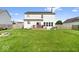 A view of the backyard with a patio, grass, and fenced property line at 12832 Broncos Dr, Fishers, IN 46037