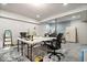 Unfinished basement with exposed walls, a table, chairs and a refrigerator at 12832 Broncos Dr, Fishers, IN 46037