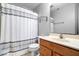 Bathroom featuring a shower/tub combo, vanity, toilet, and a large mirror at 12832 Broncos Dr, Fishers, IN 46037