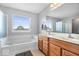 Bathroom with tub, shower and double sink vanity with plenty of natural light at 12832 Broncos Dr, Fishers, IN 46037